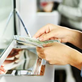 hands holding cash