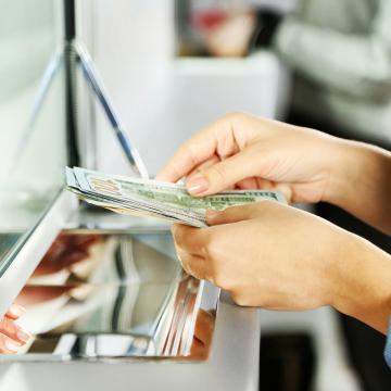 hands holding cash