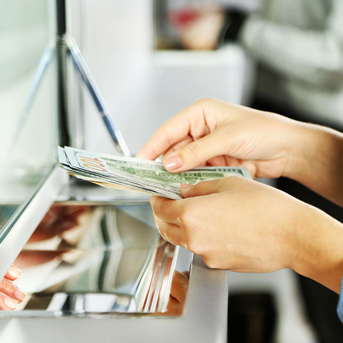 hands holding cash